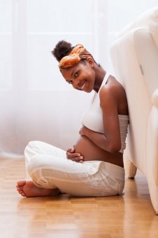 pregnant woman sitting on the floor